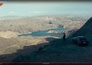 Couple overlooks a river landscape