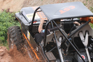 CST Team Xtreme Wildcat Dirk and Marlon Lewandowsky in a Daihatsu Wildcat F20 vehicle with CST Land Dragon tires. Action shot racing in off-road terrain.