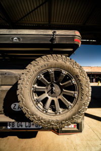 CST SAHARA A/T II Tire spare mounted on rear of vehicle.