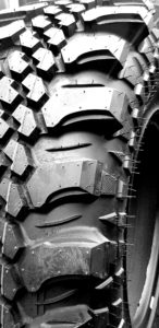 Closeup of custom grooved tread blocks on a CST Land Dragon