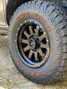 CST SAHARA AT II Tire sidewall showing raised orange lettering on the sidewall.