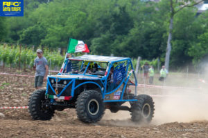 CST-SPONSORED RED TEAM of Italy action shot of their 4x4 Vehicle and Land Dragon tires racing.