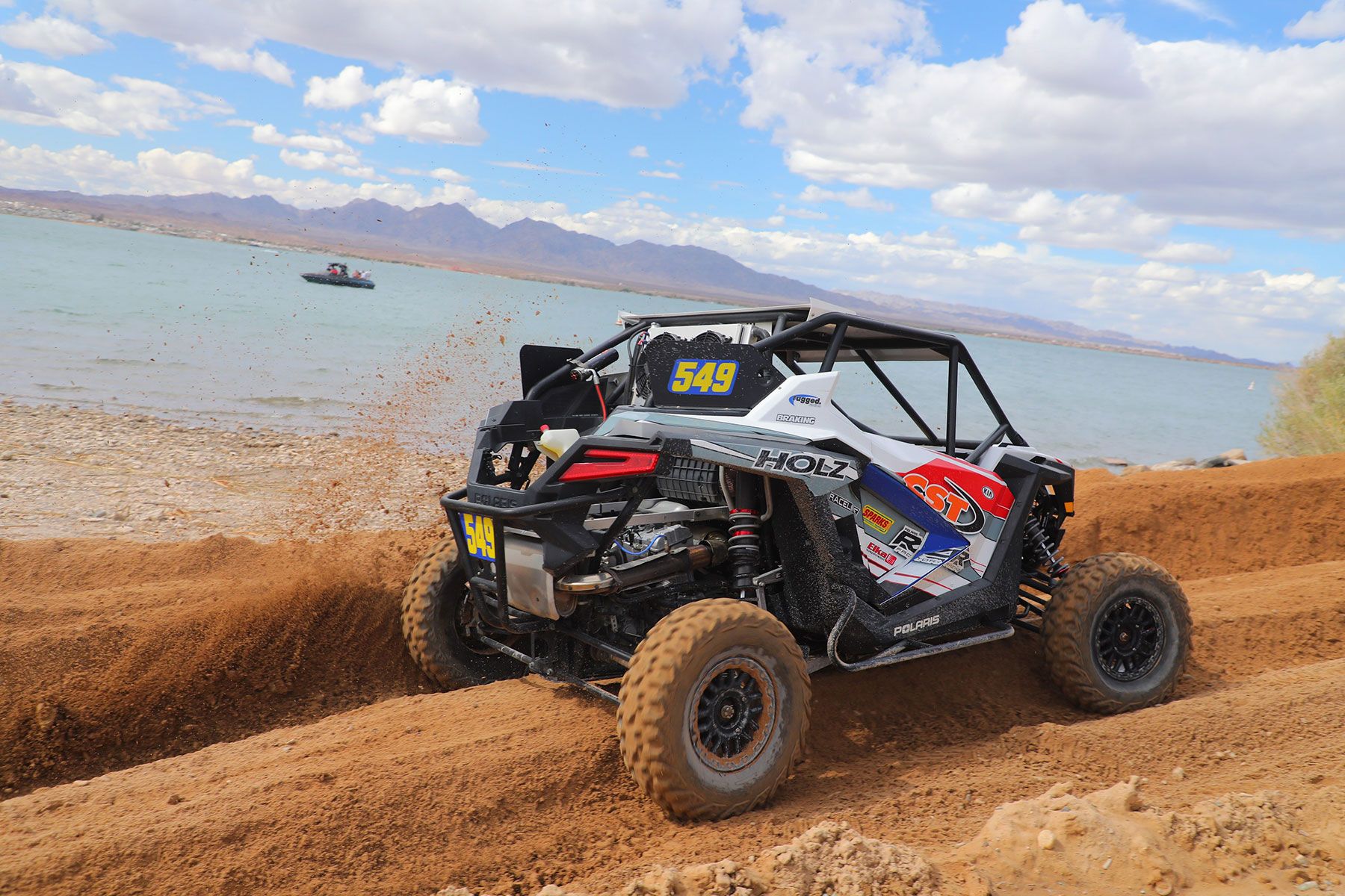 SxS racing by a lake
