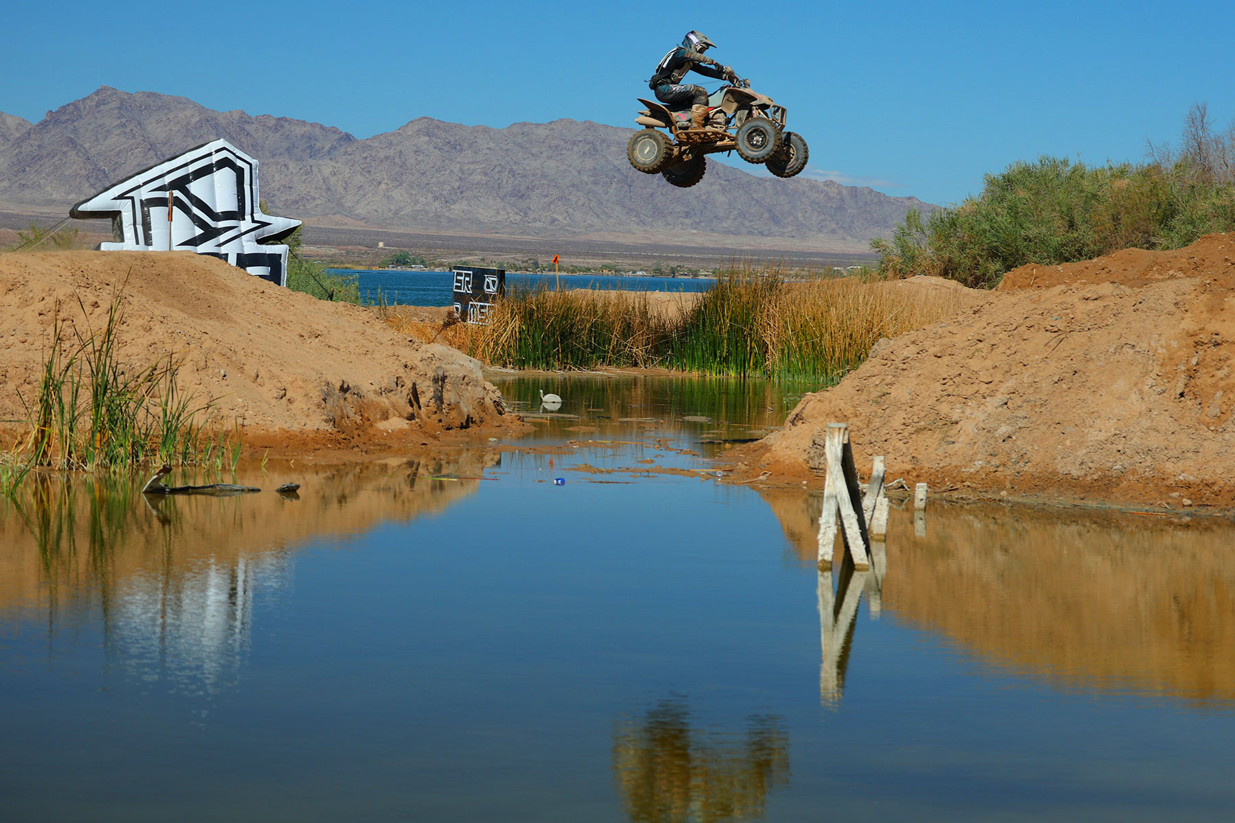 ATV jumping a creek